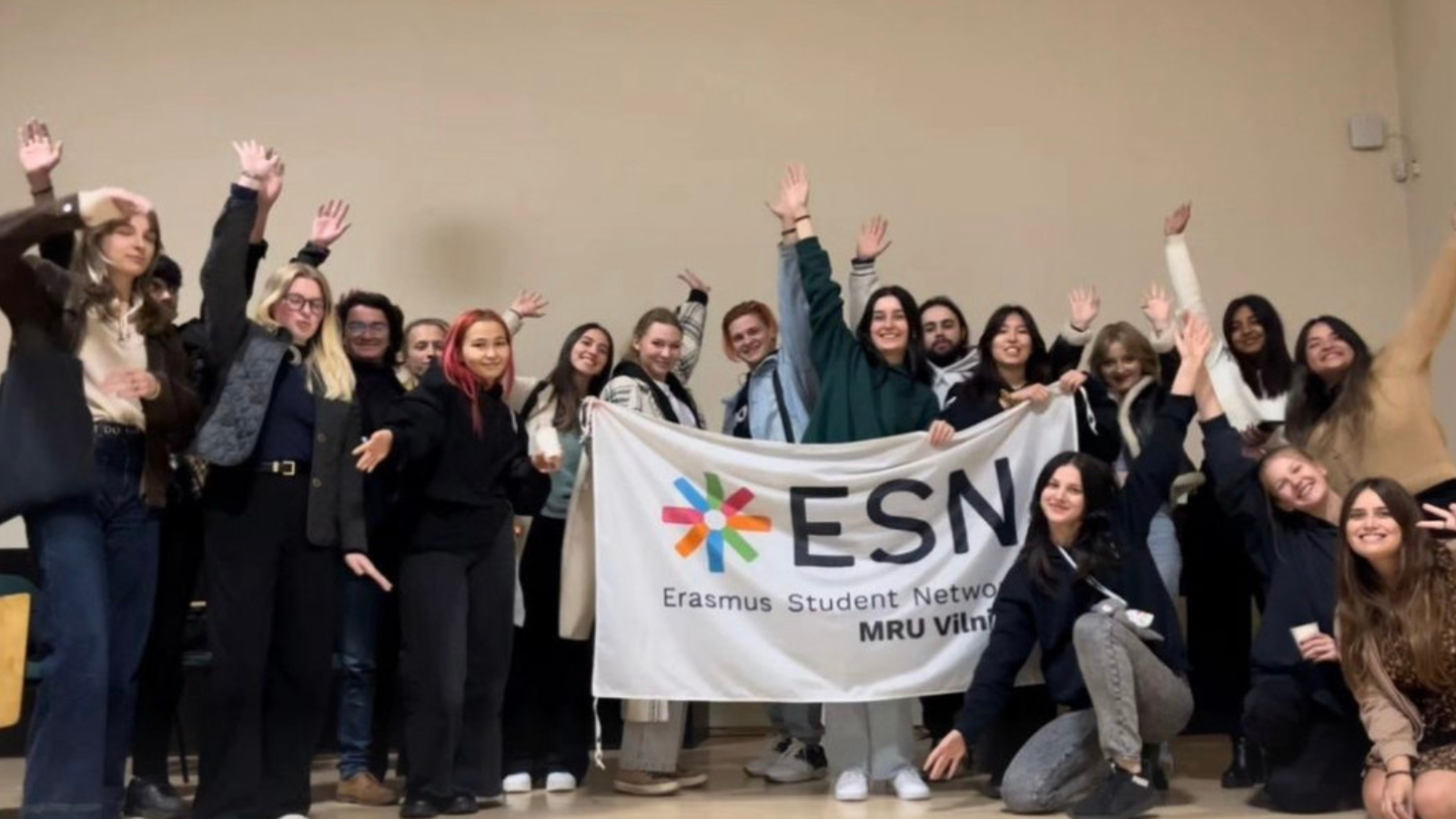 A group picture of young people holding an ESN flag.