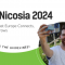 A volunteer holding a phone and ready to do a selfie during the South Eastern European Platform Nicosia 2024 event.