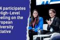 On the right side an image is shown of three people sitting on stage during a panel discussion at a high-level meeting, with a blue torn-paper graphic on the left side displaying the text: 'ESN participates in High-Level meeting on the European University Initiative.'