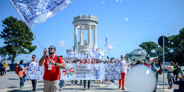 A group of people with colourful flags in front of Pasetto in Ancona, Italy,